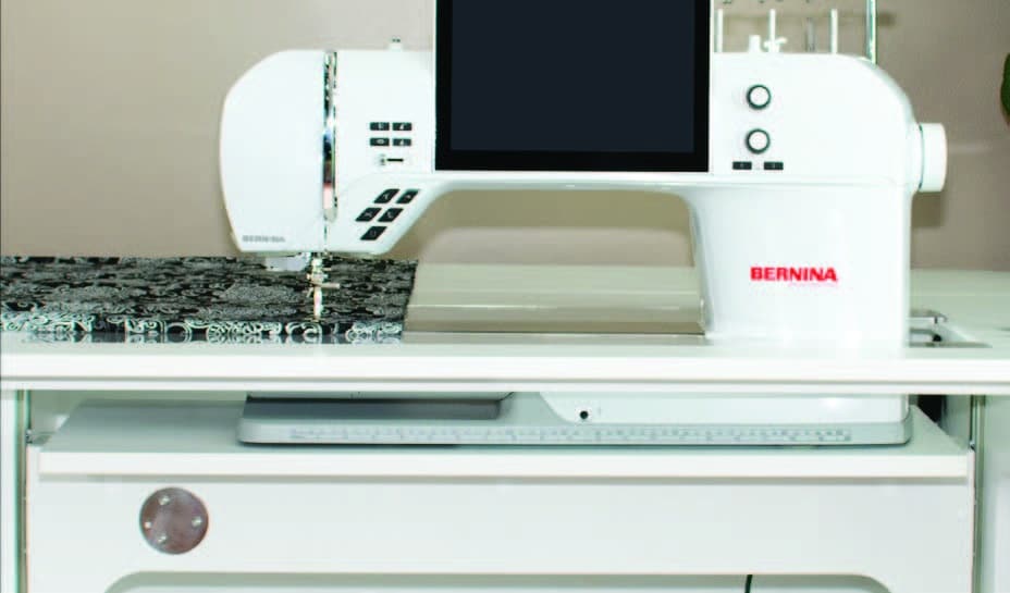 Horn Cabinet in flatbed position with machine insert around machine on lift